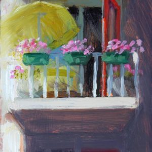 Balkon met groene parasol
